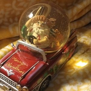 Santa snow globe in a car